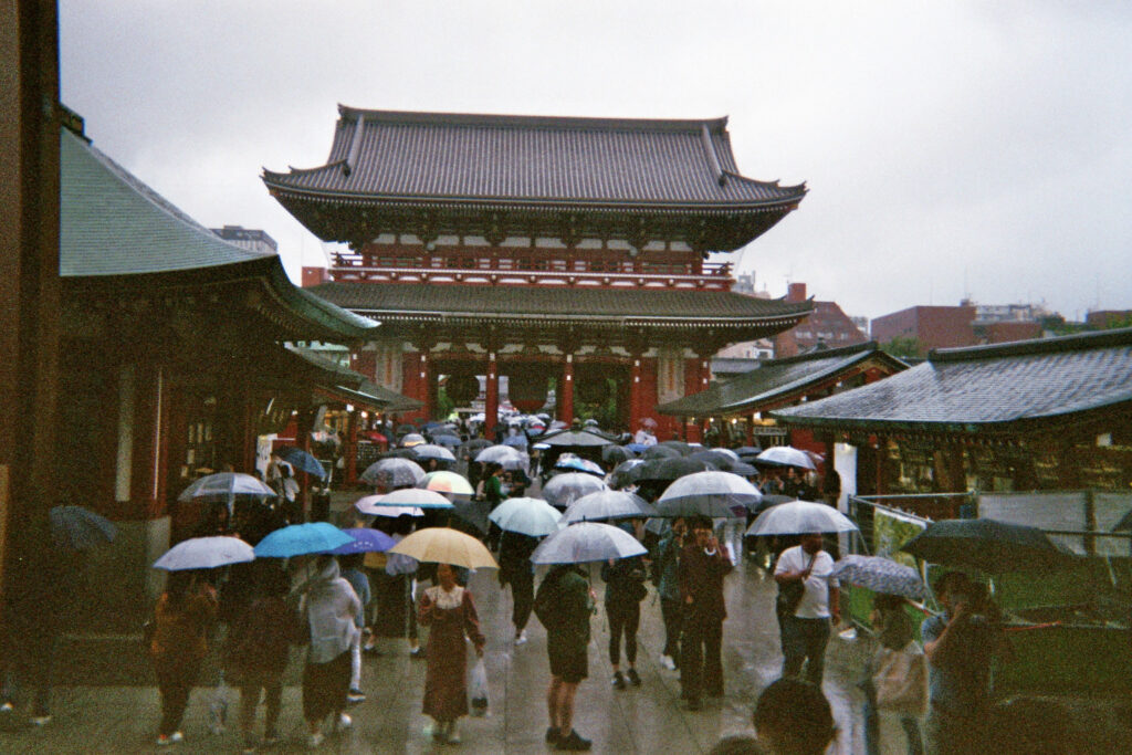 Asakusa temple in Tokyo, Japan under rainy weather and a sea of umbrellas